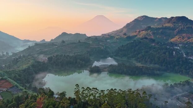 Aerial view of a misty lake and volcanic mountains Indonesia. Aerial view of a misty lake and volcanic mountains Indonesia.