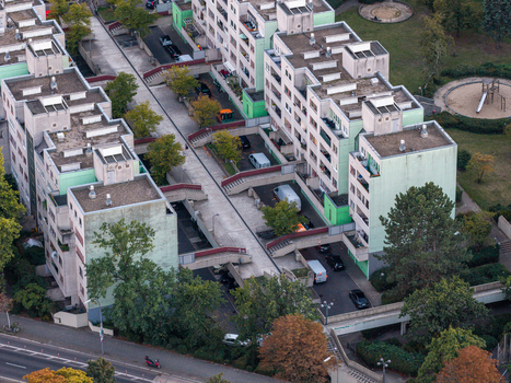 Aerial view of the High Deck Siedlung residential complex featuring elevated walkways apartment buildings and surrounding green spaces in Berlin Berlin Germany. Aerial view of the High Deck Siedlung residential complex featuring elevated walkways apartment buildings and surrounding green spaces in Berlin Berlin Germany.