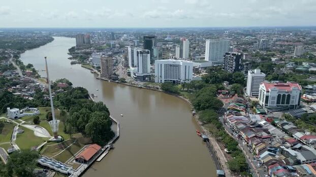 Aerial view of Kuching city skyline and Sarawak River Malaysia. Aerial view of Kuching city skyline and Sarawak River Malaysia.