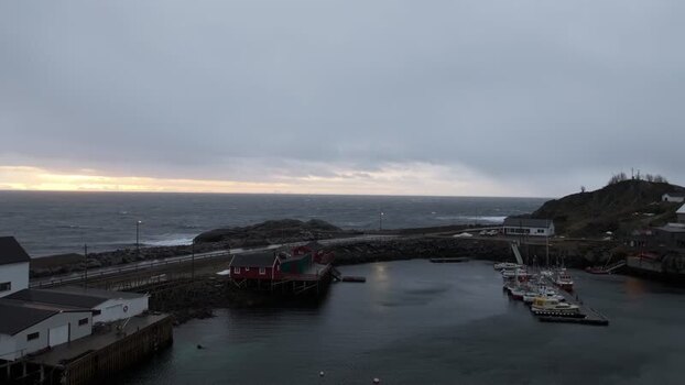 Aerial view of Lofoten harbor with red cabins in Norway.