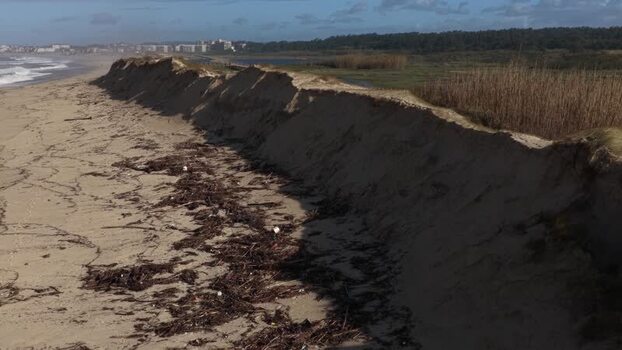 Aerial view of dune line erosion on the beach and boardwalk Portugal.