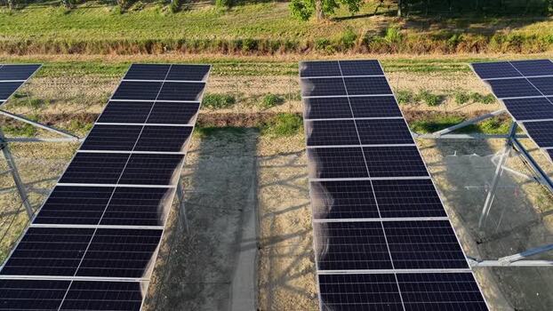 Aerial view of solar panels in a field in Faenza Italy.