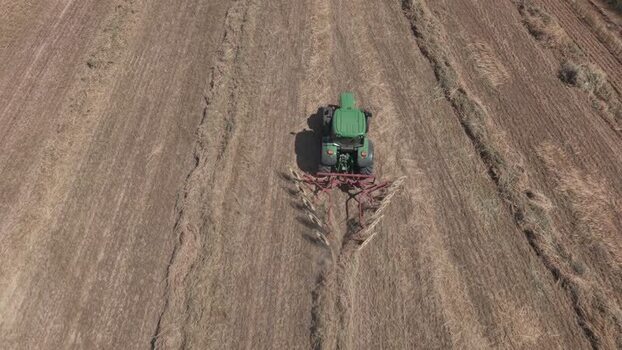 Aerial view of tractor working in a field South Africa. Aerial view of tractor working in a field South Africa.