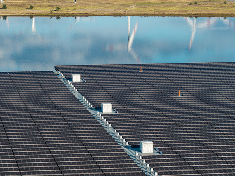Aerial view of the floating solar farm at Cottbuser Ostsee showing rows of solar panels and maintenance walkways on the water surface in Cottbus Brandenburg Germany. Aerial view of the floating solar farm at Cottbuser Ostsee showing rows of solar panels and maintenance walkways on the water surface in Cottbus Brandenburg Germany.