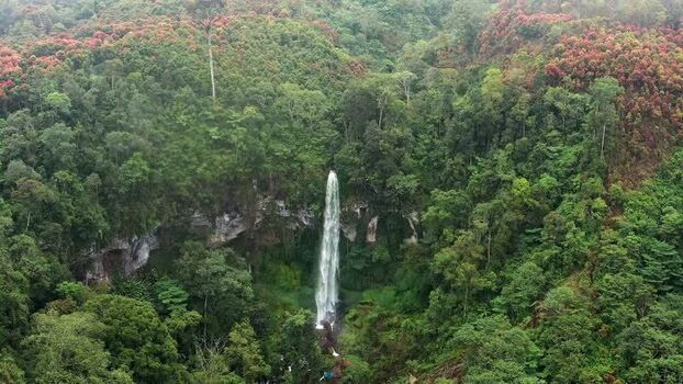 Aerial view of Waterfall Kayu Aro in the tropical forest Indonesia. Aerial view of Waterfall Kayu Aro in the tropical forest Indonesia.
