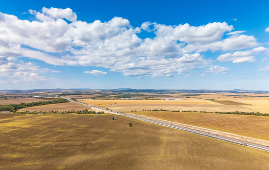 Aerial view of M1 motorway widening near Paty with traffic and machinery Aerial view of M1 motorway widening near Paty with traffic and machinery