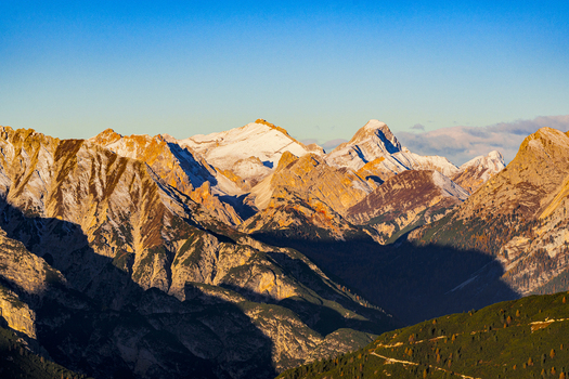 Aerial view of jagged peaks kissed by the golden sun Cima Nove and Sasso delle Dieci. Cortina d Ampezzo Veneto Italy. Aerial view of jagged peaks kissed by the golden sun Cima Nove and Sasso delle Dieci. Cortina d Ampezzo Veneto Italy.