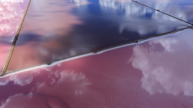 Aerial view of vibrant pink and deep blue salt production ponds with reflective water surfaces and geometric dikes in Kalbarri Western Australia Australia. Aerial view of vibrant pink and deep blue salt production ponds with reflective water surfaces and geometric dikes in Kalbarri Western Australia Australia.
