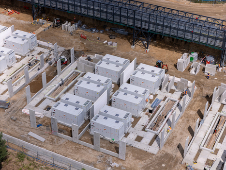 Aerial view of Zarnowiec Pumped Storage Power Station construction site with energy storage containers and concrete foundations in Wejherowo County Pomeranian Voivodeship Poland.
