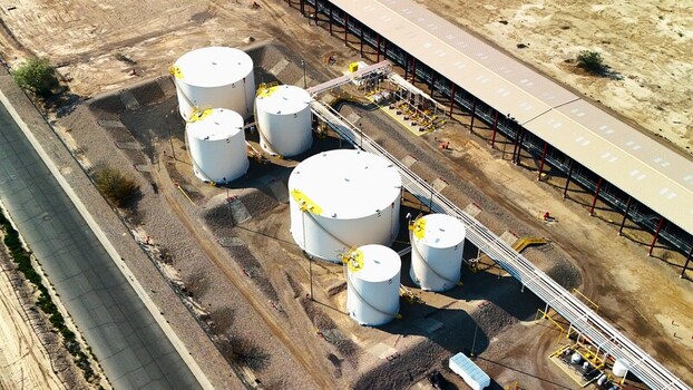 Grand Junction Colorado United States 03 July 2026 Aerial view of storage tanks at an industrial facility with pipelines and a warehouse in a desert landscape. Grand Junction Colorado United States 03 July 2026 Aerial view of storage tanks at an industrial facility with pipelines and a warehouse in a desert landscape.