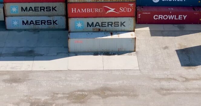 Aerial view of stacked shipping containers in United States. Aerial view of stacked shipping containers in United States.