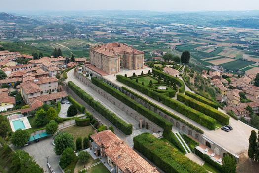 Aerial view of the historic Castello di Guarene with its manicured Italian gardens and the surrounding vineyards of the Langhe region in Guarene Piedmont Italy. Aerial view of the historic Castello di Guarene with its manicured Italian gardens and the surrounding vineyards of the Langhe region in Guarene Piedmont Italy.