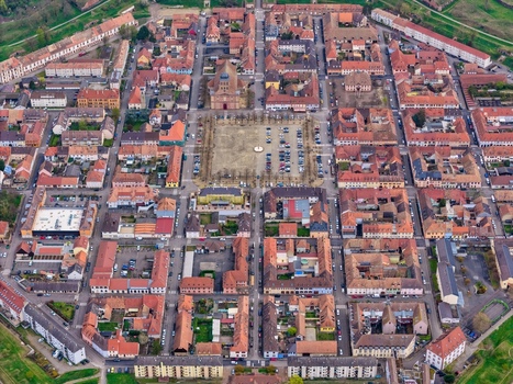 Aerial view of the octagonal fortress city a starburst of terracotta roofs and pale stone streets unfolds in geometric precision Neuf Brisach Grand Est France.