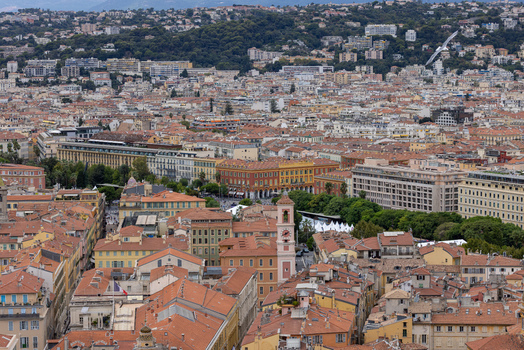 Aerial view of the historic Old Town of Nice with dense terracotta rooftops narrow streets and the bell tower of the Church of Saint Jacques le Majeur in Nice Provence Alpes Cote d Azur France. Aerial view of the historic Old Town of Nice with dense terracotta rooftops narrow streets and the bell tower of the Church of Saint Jacques le Majeur in Nice Provence Alpes Cote d Azur France.
