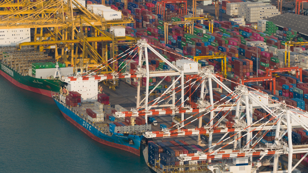 Si Racha District Thailand 08 March 2026 Aerial view of Laem Chabang International Terminal with large container ships docked and gantry cranes operating over stacks of colorful shipping containers. Si Racha District Thailand 08 March 2026 Aerial view of Laem Chabang International Terminal with large container ships docked and gantry cranes operating over stacks of colorful shipping containers.