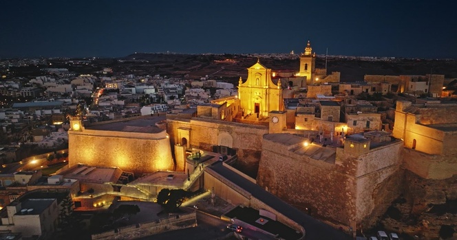 Aerial view of the illuminated Cittadella fortifications and cathedral at night in Victoria Gozo Malta. Aerial view of the illuminated Cittadella fortifications and cathedral at night in Victoria Gozo Malta.