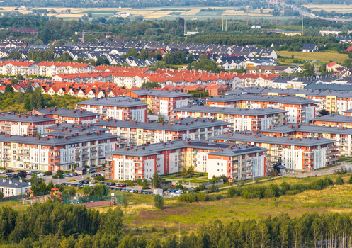 Aerial view of the residential neighborhood of Kowale with modern apartment buildings red tiled roofs green spaces and parking areas in Kowale Pomeranian Voivodeship Poland. Aerial view of the residential neighborhood of Kowale with modern apartment buildings red tiled roofs green spaces and parking areas in Kowale Pomeranian Voivodeship Poland.