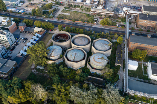 Aerial view of the Heizkraftwerk Klingenberg combined heat and power plant featuring large circular storage tanks and industrial infrastructure in Berlin Berlin Germany. Aerial view of the Heizkraftwerk Klingenberg combined heat and power plant featuring large circular storage tanks and industrial infrastructure in Berlin Berlin Germany.