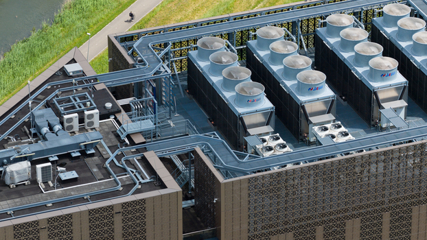 Amsterdam Noord Holland Netherlands 09 June 2026 Aerial view of Digital Realty AMS17 rooftop featuring industrial cooling towers ventilation systems and geometric facade patterns. Amsterdam Noord Holland Netherlands 09 June 2026 Aerial view of Digital Realty AMS17 rooftop featuring industrial cooling towers ventilation systems and geometric facade patterns.