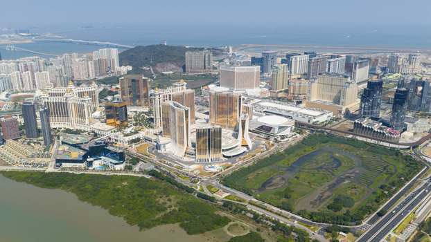 Macao 18 February 2026 Aerial view of the Cotai Strip featuring luxury hotel resorts golden skyscrapers and modern architecture surrounded by wetlands and urban infrastructure. Macao 18 February 2026 Aerial view of the Cotai Strip featuring luxury hotel resorts golden skyscrapers and modern architecture surrounded by wetlands and urban infrastructure.