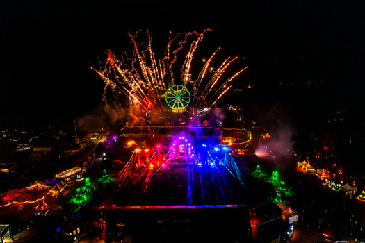 Herzogenaurach Germany 27 July 2025 Aerial view of Open Beatz Festival with vibrant stage lights a green ferris wheel and spectacular fireworks illuminating the night sky. Herzogenaurach Germany 27 July 2025 Aerial view of Open Beatz Festival with vibrant stage lights a green ferris wheel and spectacular fireworks illuminating the night sky.