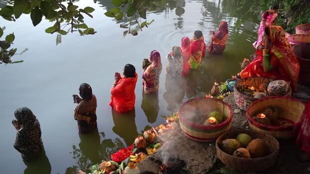 View of women performing religious rituals in a river Bangladesh. View of women performing religious rituals in a river Bangladesh.
