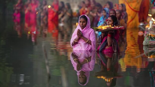 View of women performing a religious ritual in a river Bangladesh. View of women performing a religious ritual in a river Bangladesh.
