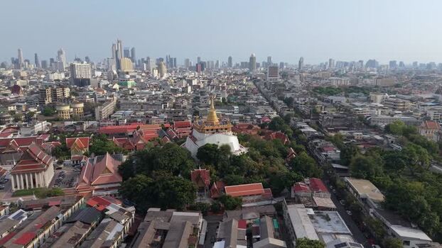 Aerial view of Wat Saket and the Bangkok city skyline Thailand.