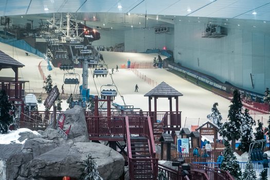 Dubai Dubai United Arab Emirates 20 April 2023 View of Ski Dubai featuring indoor ski slopes chairlifts and artificial snow with people skiing. Dubai Dubai United Arab Emirates 20 April 2023 View of Ski Dubai featuring indoor ski slopes chairlifts and artificial snow with people skiing.