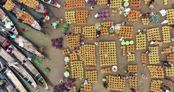 Aerial view of a bustling river market in Sylhet Bangladesh.