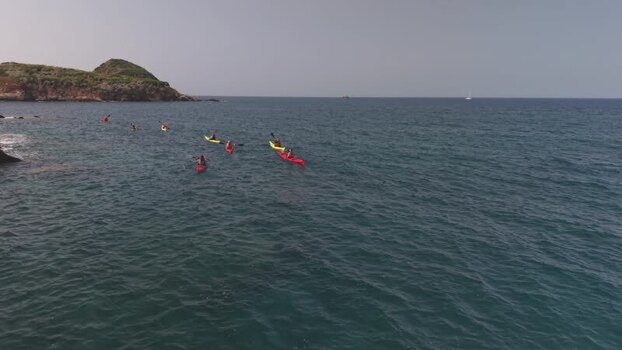 Aerial view of kayakers paddling in the sea Italy.