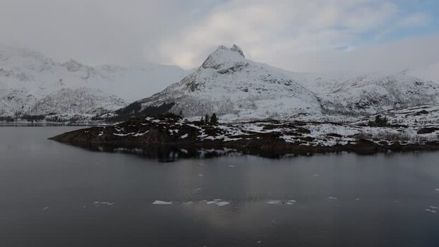 Aerial view of snow covered mountains in Lofoten Norway.