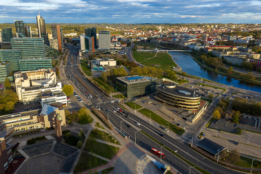 Vilnius County Lithuania 01 May 2026 Aerial view of the modern business district with skyscrapers the Neris River and urban traffic under a bright sky. Vilnius County Lithuania 01 May 2026 Aerial view of the modern business district with skyscrapers the Neris River and urban traffic under a bright sky.