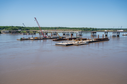 View of construction barges with cranes on the Mississippi River near the Old Chain of Rocks Bridge in St. Louis Missouri United States. View of construction barges with cranes on the Mississippi River near the Old Chain of Rocks Bridge in St. Louis Missouri United States.