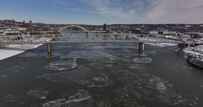 Aerial view of bridges over the icy Ohio River in winter United States. Aerial view of bridges over the icy Ohio River in winter United States.
