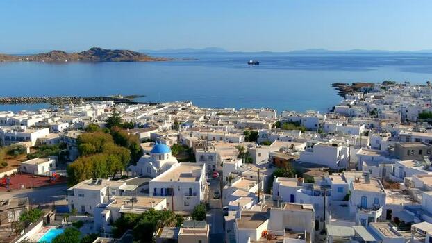 Aerial view of Cyclades town with blue domed church Greece. Aerial view of Cyclades town with blue domed church Greece.