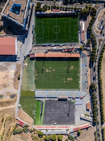Aerial view of the football field and stadium complex featuring green pitches seating areas and surrounding urban infrastructure Elvas Portalegre Portugal. Aerial view of the football field and stadium complex featuring green pitches seating areas and surrounding urban infrastructure Elvas Portalegre Portugal.