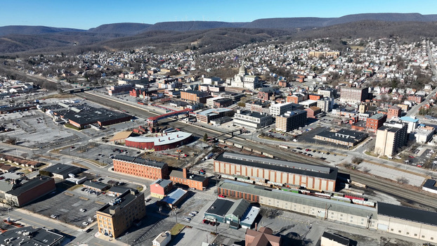 Aerial view of the city of Altoona featuring the Cathedral of the Blessed Sacrament historic railway infrastructure and surrounding urban landscape in Altoona Pennsylvania United States.