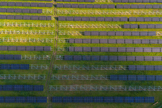 Aerial view of FVE Bohumilice solar power plant with rows of photovoltaic panels on a green field in Klobouky u Brna Jihomoravsky kraj Czechia. Aerial view of FVE Bohumilice solar power plant with rows of photovoltaic panels on a green field in Klobouky u Brna Jihomoravsky kraj Czechia.