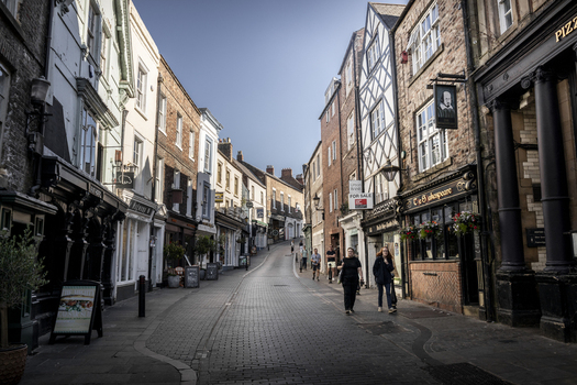 Durham United Kingdom 13 July 2026 View of a historic street in Durham with traditional timber framed buildings cobblestone pavement and pedestrians walking. Durham United Kingdom 13 July 2026 View of a historic street in Durham with traditional timber framed buildings cobblestone pavement and pedestrians walking.