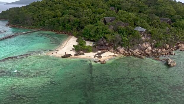 Aerial view of a tropical beach and lush coast Seychelles. Aerial view of a tropical beach and lush coast Seychelles.