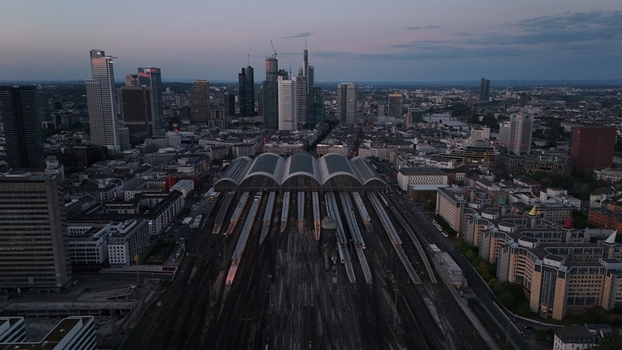 Aerial view of Frankfurt Hauptbahnhof with its iconic arched roof and railway tracks leading into the modern skyline of Frankfurt am Main Hessen Germany. Aerial view of Frankfurt Hauptbahnhof with its iconic arched roof and railway tracks leading into the modern skyline of Frankfurt am Main Hessen Germany.