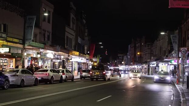 View of a busy street at night in Sydney Australia.