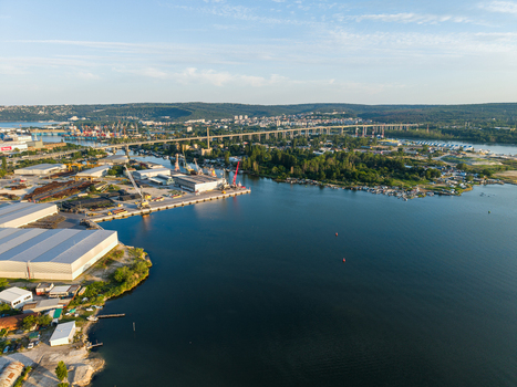 Aerial view of the Southern Industrial Zone in Varna featuring large warehouses port facilities and a long bridge spanning the water in Varna Varna Bulgaria. Aerial view of the Southern Industrial Zone in Varna featuring large warehouses port facilities and a long bridge spanning the water in Varna Varna Bulgaria.