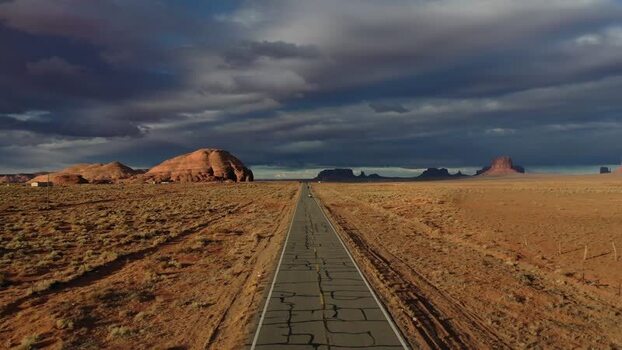 View of desert road and rock formations United States. View of desert road and rock formations United States.