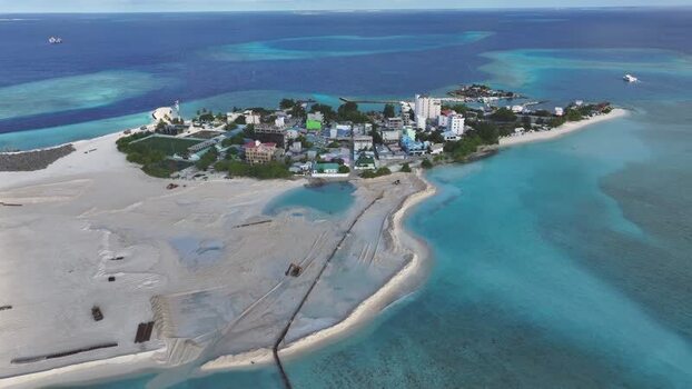 Aerial view of Gulhi island and turquoise waters Maldives. Aerial view of Gulhi island and turquoise waters Maldives.