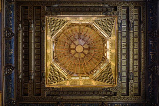 View of the ornate wooden ceiling of the Sultan al Ghuri Complex featuring intricate Islamic geometric patterns and calligraphy El Darb El Ahmar Cairo Governorate Egypt. View of the ornate wooden ceiling of the Sultan al Ghuri Complex featuring intricate Islamic geometric patterns and calligraphy El Darb El Ahmar Cairo Governorate Egypt.