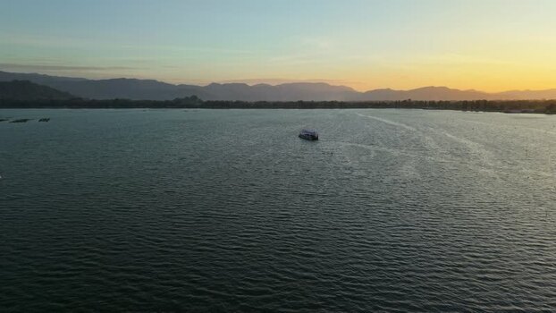 Aerial view of boat sailing on water Indonesia. Aerial view of boat sailing on water Indonesia.