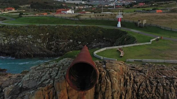 Aerial view of O Vixiador sculpture on the rocky coast Spain.