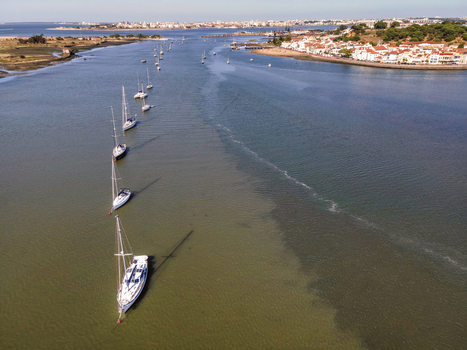Aerial view of sailing boats docked in Seixal bay near the lagoon Setubal municipality Portugal.